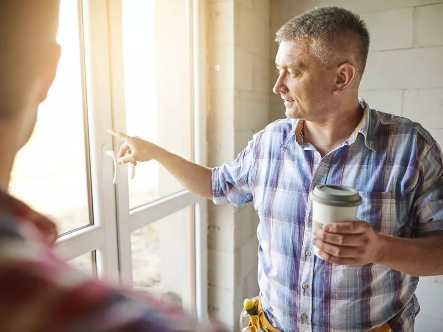 handsome-young-carpenter-working-with-experienced-man.jpg