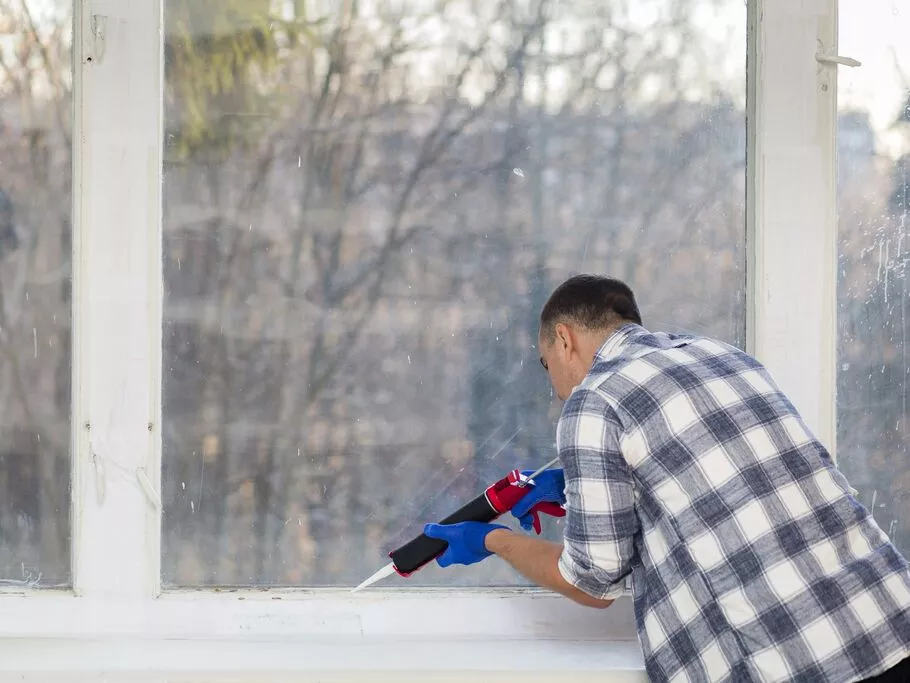 man-putting-silicone-wall.jpg